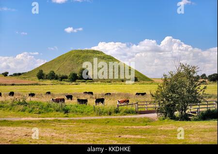 Silbury Hill artificial Neolithic prehistoric chalk mound outside village of Avebury, Wiltshire England. 4750 years old 40m high Stock Photo