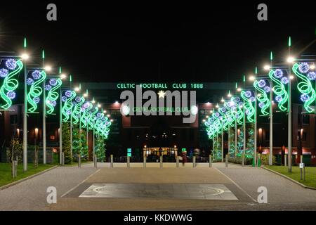 The Celtic Way adorned with festive christmas lights leading up to Celtic Park football stadium at night in Glasgow, Scotland, UK Stock Photo