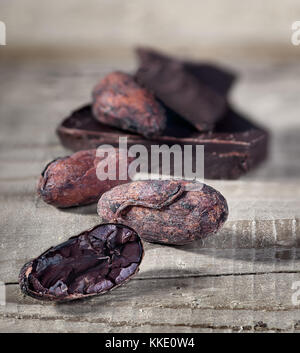 Cocoa beans and piece of dark chocolate Stock Photo