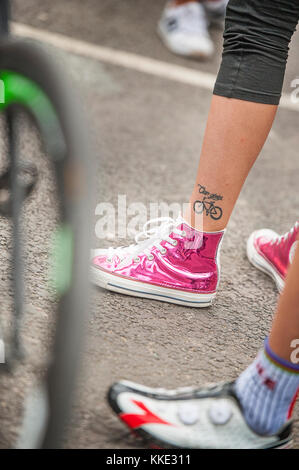A tattoo detail, on girls left leg, of bicycle at the Redhook Crit race  London. Stock Photo