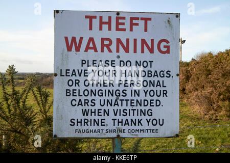 theft warning sign at st brigids shrine county louth republic of ireland typically irish mentioning handbags Stock Photo