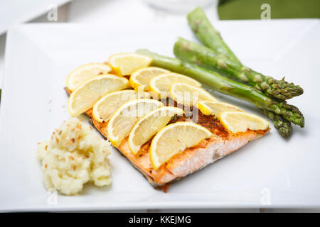 Salmon grilled with cauliflower mashed and asparagus. Stock Photo