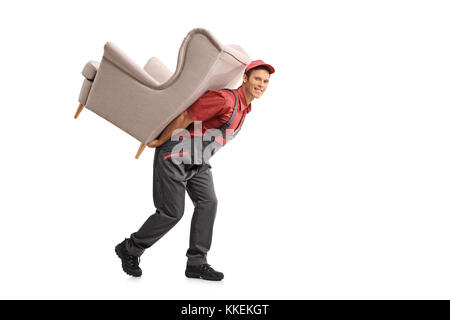 Full length portrait of a mover carrying an armchair on his back isolated on white background Stock Photo