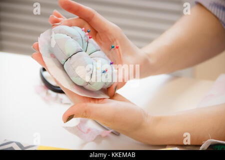 Pins and needles in a pin sponge, tailor accessories Stock Photo