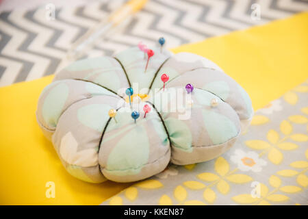 Pins and needles in a pin sponge, tailor accessories Stock Photo