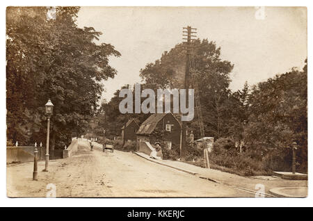 On the reverse side is inscribed 'Prittlewell (near Priory) app 1895'.  This is Victoria Avenue, Prittlewell, Southend-on-Sea, Essex, England, then known as North Street, by the entrance to what is now Priory Park, where the road crosses Prittle Brook, at the end of the nineteenth century.
