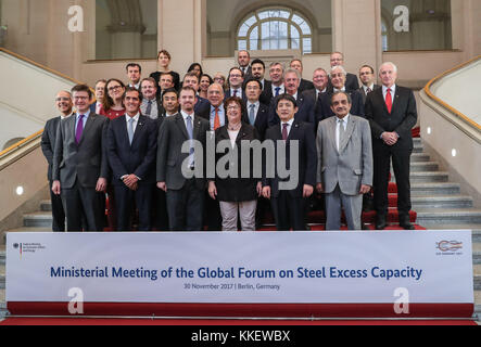 Berlin, Germany. 30th Nov, 2017. Delegates pose for a group photo after the ministerial meeting of Global Forum on Steel Excess Capacity in Berlin, Germany, on Nov. 30, 2017. China called for more global cooperation in addressing the steel overcapacity across the world at the Ministerial meeting of Global Forum on Steel Excess Capacity held here on Thursday. Credit: Shan Yuqi/Xinhua/Alamy Live News Stock Photo