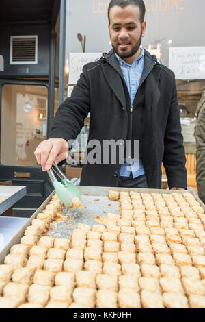 Mill Road Cambridge, UK. 2nd Dec, 2017. Traders prepare street food at the annual Winter Fair which takes place in early December. The event includes a food fair with street food stalls, music, children's activities, parades and promotions by local community groups and traders. Mill Road is famous for it's independent shops and diverse communities. Credit: Julian Eales/Alamy Live News Stock Photo