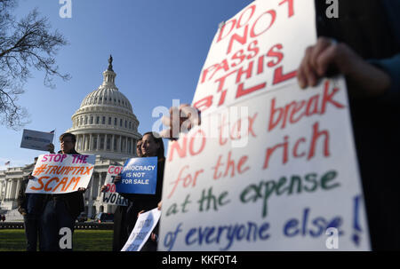 Washington, USA. 1st Dec, 2017. People protest against tax reform on Capitol hill in Washington, DC, the United States, on Dec. 1, 2017. The U.S. Senate on Saturday morning narrowly passed the Republican bill to overhaul the tax code in decades, moving one step closer to the first major legislative victory of the Trump administration and congressional Republicans. Credit: Yin Bogu/Xinhua/Alamy Live News