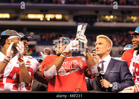 Indianapolis, Indiana, USA. 3rd Dec, 2017. Ohio State Buckeyes running back J.K. Dobbins (2) hoists MVP trophy at the BigTen Championship Football Game between the Ohio State Buckeyes and the Wisconsin Badgers at Lucas Oil Stadium in Indianapolis, Indiana. JP Waldron/Cal Sport Media/Alamy Live News Stock Photo