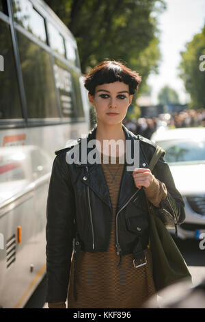Fashionable Woman Poses Outside Gucci Fashion Show Building For Milan Women's  Fashion Week In Milan. Stock Photo, Picture and Royalty Free Image. Image  201391644.