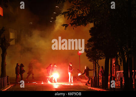 Athens, Greece. 6th Dec, 2017. Students throw Molotov cocktails at anti-riot police during a rally commemorating the death of a teenage student in Athens, Greece, on Dec. 6, 2017. Clashes with anti-riot forces ended a series of rallies organized by student unions, left-wing parties and anti-establishment groups in the center of Athens on Wednesday to mark the ninth anniversary of the fatal police shooting of the 15-year-old high school student Alexandros Grigoropoulos in 2008. Credit: Marios Lolos/Xinhua/Alamy Live News Stock Photo