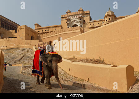 JAIPUR, INDIA, October 27, 2017 : Riding elephants up to the Amber palace complex. Amber Fort is the principal tourist attraction in the Jaipur area.  Stock Photo