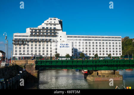 The Grand Burstin Hotel in Folkstone, Kent, UK. Part of the Britannia hotel group and view of the harbour Stock Photo