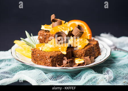 Chocolate cake with orange fruit on a plate Stock Photo