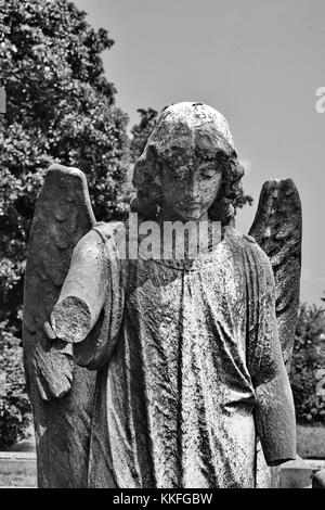 The Archangel Gabriel rendered in stone atop a grave in historic Hollywood Cemetery in Richmond, Virginia. Stock Photo