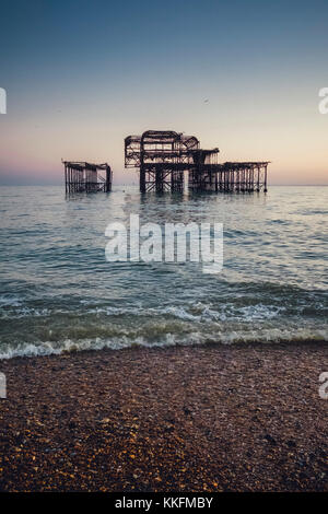 Burnt West Pier at dusk, Brighton, England Stock Photo