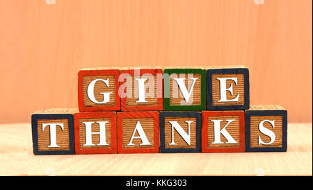 Giving Thanks Happy Thanksgiving concept on wood blocks Stock Photo