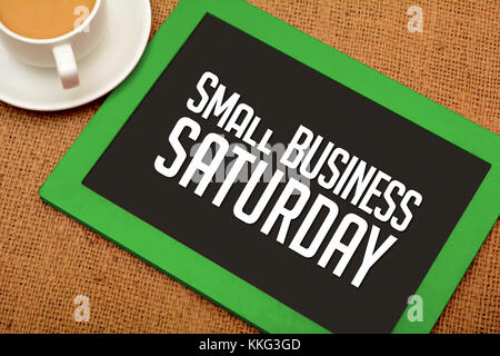 Small Business Saturday design on chalkboard with tea cup Stock Photo