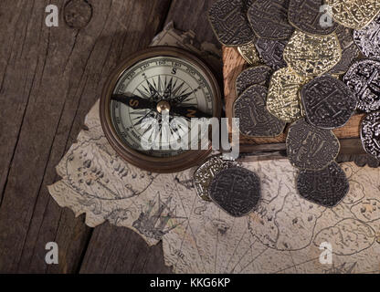 Antique golden compass and old map Stock Photo - Alamy