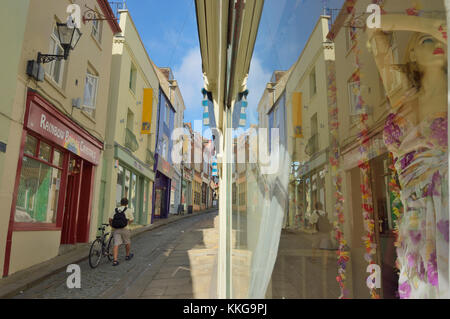 Colourful shops and cafes line the steep and cobbled Old High Street, in the Creative Quarter, Folkestone, Kent, UK Stock Photo