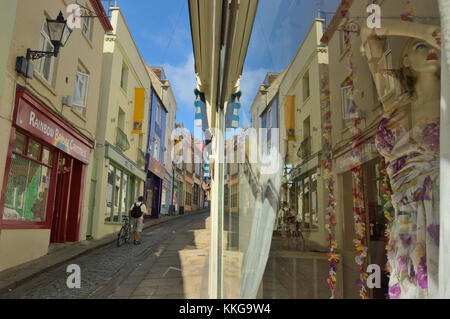 Colourful shops and cafes line the steep and cobbled Old High Street, in the Creative Quarter, Folkestone, Kent, UK Stock Photo