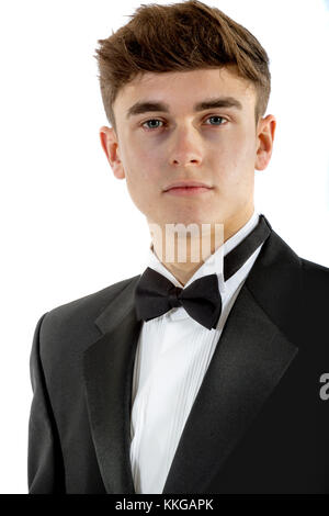 18 year old wearing a tuxedo isolated on a white background Stock Photo