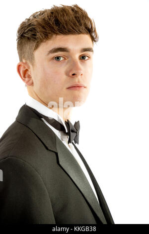 18 year old wearing a tuxedo isolated on a white background Stock Photo