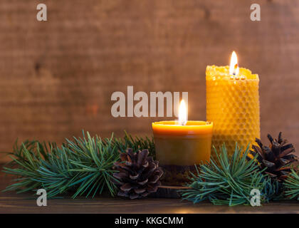 Burning handmade beewax candle with cinnamon.Advent wreath Stock Photo