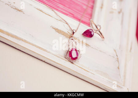 Luxury necklace with gem stone pendant and ring in same design Stock Photo