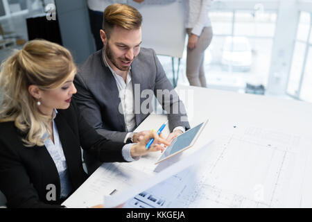 Two young architects working together in office Stock Photo