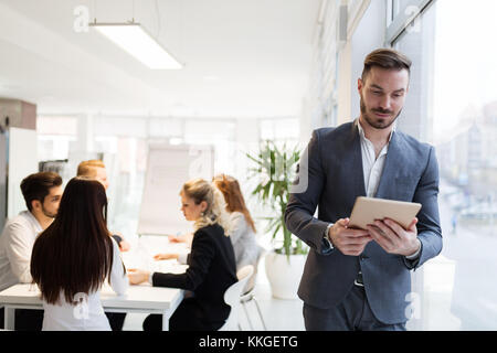 Young male architect using digital tablet in office Stock Photo