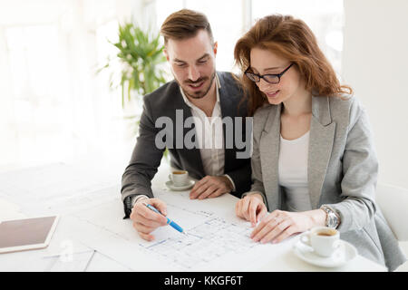 Two young architects working together in office Stock Photo