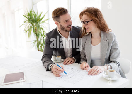 Two young architects working together in office Stock Photo
