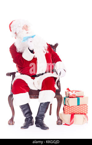 Santa launching paper airplane Stock Photo