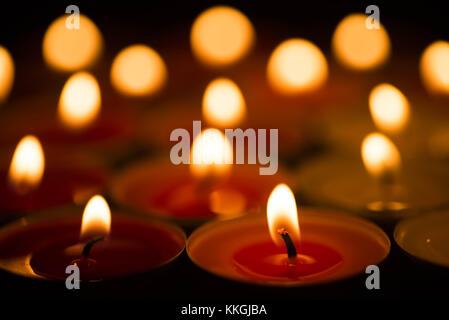 closeup to burning tealights in warm colors Stock Photo