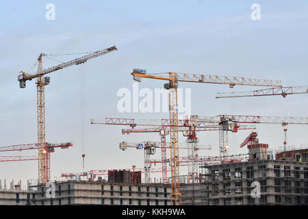 Berlin, Germany. 9th Oct, 2017. Construction cranes stick out in front of the morning sky in Berlin, Germany, 9 October 2017. Credit: Paul Zinken/dpa/Alamy Live News Stock Photo