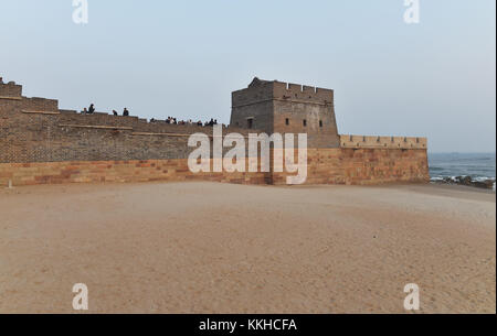 Qinhuangda, Qinhuangda, China. 30th Nov, 2017. Qinhuangdao, CHINA-November 2017:(EDITORIAL USE ONLY. CHINA OUT) .Laolongtou Great Wall, located at Shanhaiguan Scenic Area in Qinhuangdao, north China's Hebei Province, is also known as Old Dragon's Head Great Wall. Laolongtou is where the Great Wall of China meets the sea and was once considered as where the Great Wall of China starts. Laolongtou means Old Dragon'ss Head, so named because the Great Wall here resembles a dragon drinking water from the sea. Laolongtou is the only section of the great wall that extends into the sea. (Credit I Stock Photo