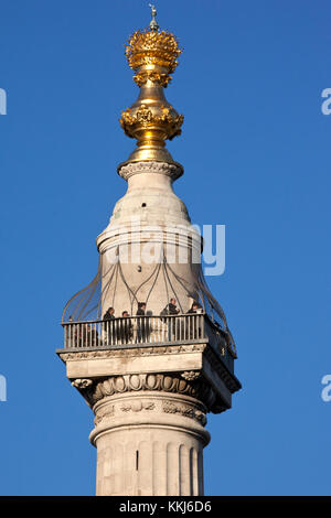 Tourists at the viewpoint at the top of 'The Monument to the Great Fire of London', more commonly known simply as 'The Monument', is a stone Roman Dor Stock Photo