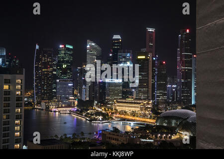 Dusk shot of  the Marina Bay area in Singapore, taken from the Pan Pacific Hotel showing the Singapore skyline at night Stock Photo