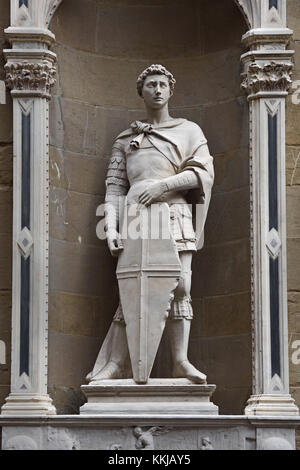 Saint George (Guild of Armourers and Swordmakers) 1417 by Donatello facade of the Orsanmichele ( or Kitchen Garden of St. Michael ) is a church in Florence ( In 1336 as a market and grain storage area, as on commission of the Silk guild (silk union). Florence Italy . Stock Photo