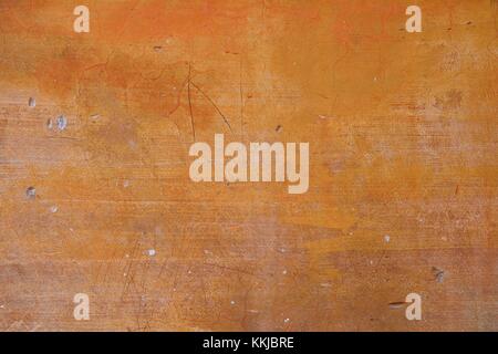 Wall background ocher with damage. Stock Photo