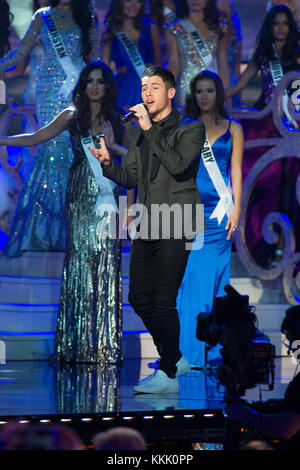 DORAL, FL - JANUARY 25:  Nick Jonas 2014 on stage at the 63rd Annual Miss Universe Pageant at Trump National Doral on January 25, 2015 in Doral, Florida.  People:  Nick Jonas Stock Photo