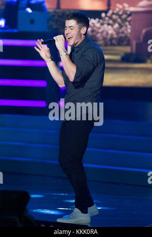 DORAL, FL - JANUARY 25:  Nick Jonas 2014 on stage at the 63rd Annual Miss Universe Pageant at Trump National Doral on January 25, 2015 in Doral, Florida.  People:  Nick Jonas Stock Photo