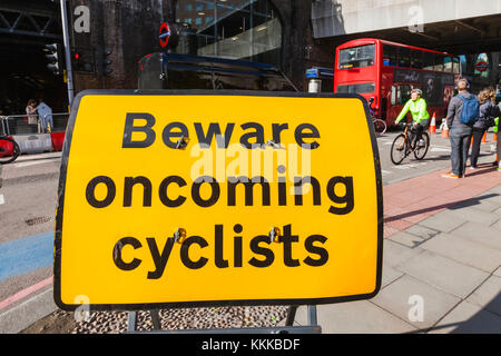 England, London, Beware Oncoming Cyclists Warning Sign Stock Photo - Alamy