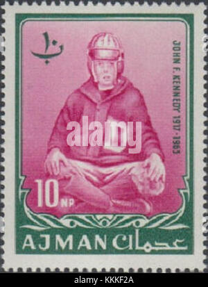 A 1964 stamp from Ajman featuring a portrait of President John F. Kennedy. This collectible stamp was issued as part of a commemorative series. Stock Photo