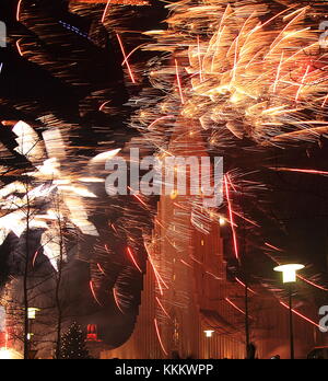 Reykjavík, Iceland, New Year Eve, Fireworks near Hallgrímskirkja - modern cathedral with striking bell tower. Stock Photo