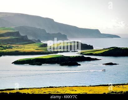 Rugged edge of Iveragh peninsula dips into the Atlantic at Dromgour. South from Bray Head on Valencia Island. Co. Kerry, Ireland Stock Photo