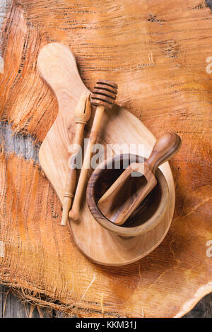 Olive wood kitchen utensil over wooden table. Top view. See series. Stock Photo
