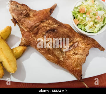 Cuy  ( cooked Guinea pig), typical andean dish Stock Photo